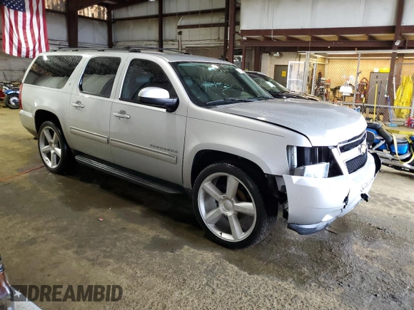 2013 Chevrolet Suburban LT with VIN 1GNSCJE00DR260275, listed as a Copart auction lot 50394425 with 140,464 mi miles and Salvage title. Bid and sale history available at DreamBid. Image 4.