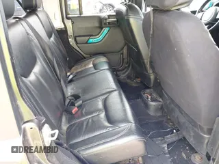 2014 Jeep Wrangler Unlimited Sahara with VIN 1C4BJWEG8EL285843, listed as a IAAI auction lot 42399090 with Not provided miles and . Bid and sale history available at DreamBid. Image 8.