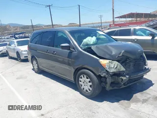 2009 Honda Odyssey LX z VIN 5FNRL382X9B041112, wystawiony jako IAAI lot #42324656 z przebiegiem 136 159 mil mil oraz . Historia ofert i sprzedaży dostępna na DreamBid. Obrazek 1.