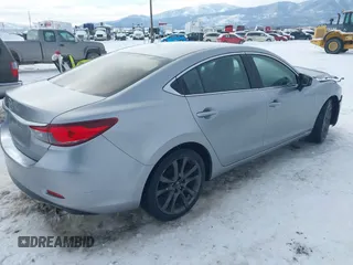 2014 Mazda Mazda6 i Touring with VIN JM1GJ1V62E1134427, listed as a IAAI auction lot 41550411 with 112,804 mi miles. Bid and sale history available at carsss.com. Image 4.