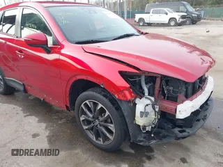 2016 Mazda CX-5 Grand Touring with VIN JM3KE4DY9G0865780, listed as a IAAI auction lot 41913914 with 76,579 mi miles. Bid and sale history available at carsss.com. Image 19.