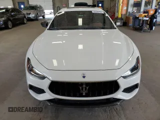 2023 Maserati Ghibli Modena z VIN ZAM57YSMXPX411516, wystawiony jako Copart lot #58330765 z przebiegiem Nie podano mil oraz Szkoda całkowita • Salvage title. Historia ofert i sprzedaży dostępna na DreamBid. Obrazek 5.