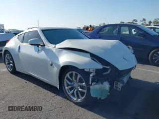 2014 Nissan 370Z Touring z VIN JN1AZ4EH7EM635655, wystawiony jako IAAI lot #42217280 z przebiegiem 150 200 mil mil oraz . Historia ofert i sprzedaży dostępna na DreamBid. Obrazek 1.