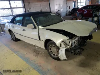 2002 Lincoln Town Car Cartier with VIN 1LNHM83W22Y662670, listed as a Copart auction lot 83526144 with 75,072 mi miles and Salvage Title. Bid and sale history available at carsss.com. Image 4.