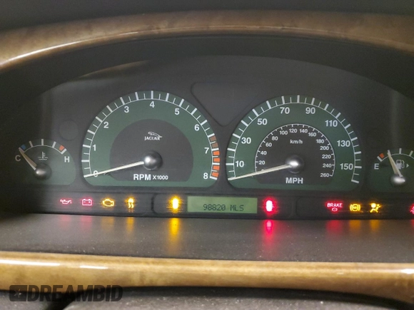 2003 Jaguar S-Type z VIN SAJEA01U93HM84195, wystawiony jako Copart lot #54300574 z przebiegiem 98 820 mil mil oraz Czysty tytuł • Clean title. Historia ofert i sprzedaży dostępna na DreamBid. Obrazek 9.