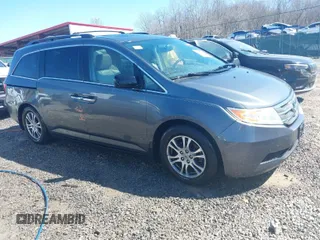 2013 Honda Odyssey EX-L with VIN 5FNRL5H66DB041471, listed as a IAAI auction lot 41543113 with 171,612 mi miles and . Bid and sale history available at carsss.com. Image 1.