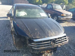 2020 Volkswagen Jetta SEL z VIN 3VWE57BU2LM093697, wystawiony jako IAAI lot #40437984 z przebiegiem 76 803 mil mil oraz . Historia ofert i sprzedaży dostępna na DreamBid. Obrazek 13.
