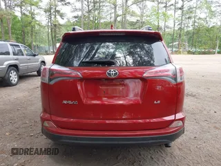 2016 Toyota RAV4 LE with VIN JTMZFREV4GJ062701, listed as a IAAI auction lot 42084694 with 121,553 mi miles and . Bid and sale history available at DreamBid. Image 17.