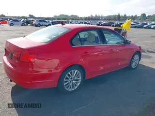 2014 Volkswagen Jetta TDI w/Premium with VIN 3VWLL7AJ8EM372627, listed as a IAAI auction lot 42418054 with 119,926 mi miles and . Bid and sale history available at DreamBid. Image 4.