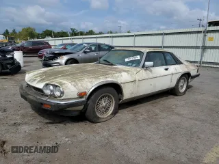 1989 Jaguar XJS z VIN SAJNY584XKC161154, wystawiony jako Copart lot #70912984 z przebiegiem 65 188 mil mil oraz Tytuł czysty. Historia ofert i sprzedaży dostępna na DreamBid. Obrazek 1.