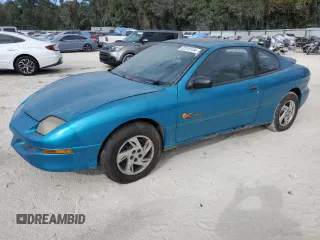1999 Pontiac Sunfire SE z VIN 1G2JB124XX7563650, wystawiony jako Copart lot #82518154 z przebiegiem 224 428 mil mil oraz Szkody całkowita. Historia ofert i sprzedaży dostępna na DreamBid. Obrazek 1.