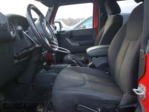 2015 Jeep Wrangler Willys Wheeler with VIN 1C4AJWAG9FL543998, listed as a Copart auction lot 88947025 with 142,433 mi miles and Salvage title. Bid and sale history available at DreamBid. Image 7.