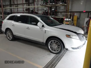 2013 Lincoln MKT EcoBoost with VIN 2LMHJ5AT3DBL56954, listed as a IAAI auction lot 41705877 with 148,771 mi miles. Bid and sale history available at carsss.com. Image 1.