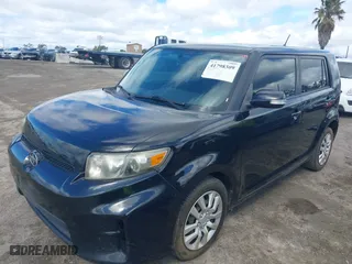 2012 Scion xB with VIN JTLZE4FEXCJ024876, listed as a IAAI auction lot 41798309 with 89,853 mi miles. Bid and sale history available at carsss.com. Image 2.