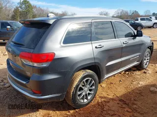 2015 Jeep Grand Cherokee Summit with VIN 1C4RJFJG8FC679185, listed as a IAAI auction lot 41653531 with 158,186 mi miles and . Bid and sale history available at DreamBid. Image 4.
