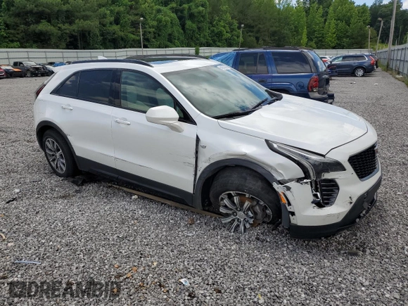 2019 Cadillac XT4 FWD Sport with VIN 1GYFZER44KF210582, listed as a Copart auction lot 61272015 with 104,073 mi miles and Salvage title. Bid and sale history available at DreamBid. Image 4.