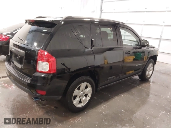 2014 Jeep Compass Sport with VIN 1C4NJCBA3ED777881, listed as a IAAI auction lot 41845518 with 113,566 mi miles. Bid and sale history available at carsss.com. Image 4.