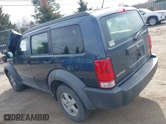 2008 Dodge Nitro SXT with VIN 1D8GU28K28W189765, listed as a IAAI auction lot 41834961 with 214,837 mi miles. Bid and sale history available at carsss.com. Image 3.