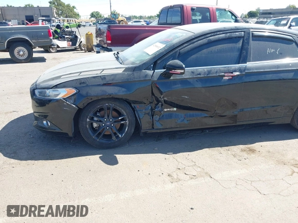 2016 Ford Fusion SE Hybrid z VIN 3FA6P0LU4GR260180, wystawiony jako IAAI lot #42508932 z przebiegiem 97 475 mil mil oraz . Historia ofert i sprzedaży dostępna na DreamBid. Obrazek 6.