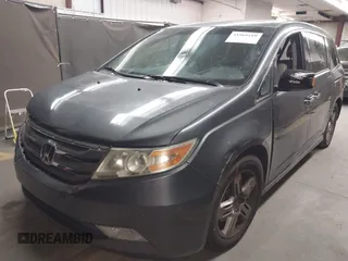2012 Honda Odyssey Touring с VIN 5FNRL5H99CB047340, выставлен на аукционе IAAI как лот 41965189 с пробегом Не указан миль и . История ставок и продаж доступна на DreamBid. Изображение 17.