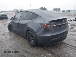 2022 Tesla Model Y Performance with VIN 7SAYGDEF1NF379167, listed as a IAAI auction lot 41429842 with 86,582 mi miles and . Bid and sale history available at DreamBid. Image 3.
