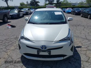 2016 Toyota Prius Four with VIN JTDKARFUXG3511034, listed as a IAAI auction lot 42137394 with 77,424 mi miles. Bid and sale history available at carsss.com. Image 12.