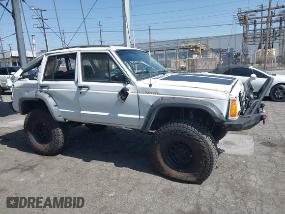 1991 Jeep Cherokee Country z VIN 1J4FJ78S7ML632675, wystawiony jako IAAI lot #42283175 z przebiegiem 116 062 mil mil oraz . Historia ofert i sprzedaży dostępna na DreamBid. Obrazek 13.