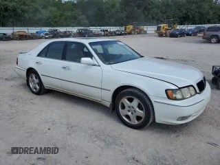 1999 Infiniti Q45 z VIN JNKBY31A2XM603477, wystawiony jako Copart lot #64216924 z przebiegiem 278 602 mil mil oraz Szkody całkowita. Historia ofert i sprzedaży dostępna na DreamBid. Obrazek 4.