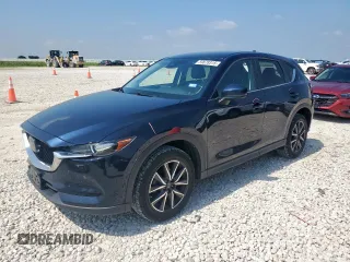 2018 Mazda CX-5 Touring z VIN JM3KFACM4J1431634, wystawiony jako Copart lot #59678315 z przebiegiem 103 633 mil mil oraz Szkoda całkowita • Salvage title. Historia ofert i sprzedaży dostępna na DreamBid. Obrazek 1.