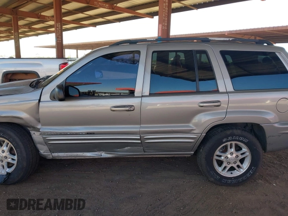 2000 Jeep Grand Cherokee Limited z VIN 1J4GW58N1YC206992, wystawiony jako IAAI lot #42057236 z przebiegiem 183 986 mil mil oraz . Historia ofert i sprzedaży dostępna na DreamBid. Obrazek 14.