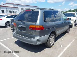 1998 Toyota Sienna LE z VIN 4T3ZF13C9WU036694, wystawiony jako IAAI lot #42231375 z przebiegiem 192 027 mil mil oraz . Historia ofert i sprzedaży dostępna na DreamBid. Obrazek 4.