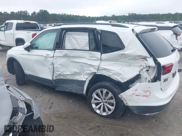 2018 Volkswagen Tiguan S with VIN 3VV1B7AX1JM032250, listed as a IAAI auction lot 42366790 with 65,406 mi miles and . Bid and sale history available at DreamBid. Image 14.