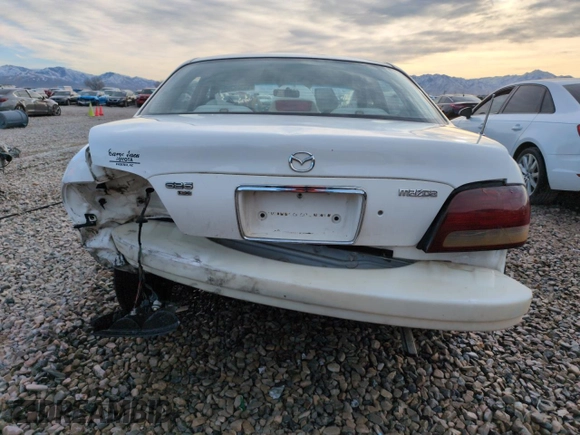 1999 Mazda 626 ES z VIN 1YVGF22C9X5887587, wystawiony jako Copart lot #46346305 z przebiegiem 92 715 mil mil oraz Szkoda całkowita • Salvage title. Historia ofert i sprzedaży dostępna na DreamBid. Obrazek 6.