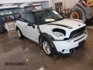 2015 MINI Cooper Countryman S with VIN WMWZC5C57FWP42322, listed as a IAAI auction lot 41299310 with 123,714 mi miles. Bid and sale history available at carsss.com. Image 1.