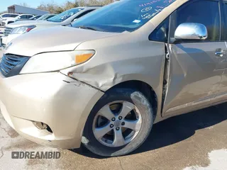 2012 Toyota Sienna with VIN 5TDKA3DC1CS011022, listed as a IAAI auction lot 41415386 with 209,552 mi miles and . Bid and sale history available at DreamBid. Image 6.