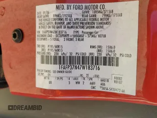 2007 Ford Focus S with VIN 1FAFP37N47W183716, listed as a Copart auction lot 87702785 with 203,315 mi miles and Salvage Title. Bid and sale history available at carsss.com. Image 12.