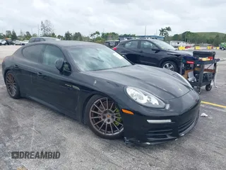 2015 Porsche Panamera S E-Hybrid z VIN WP0AD2A72FL040703, wystawiony jako IAAI lot #41937431 z przebiegiem 77 933 mil mil oraz . Historia ofert i sprzedaży dostępna na DreamBid. Obrazek 1.