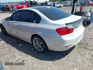 2014 BMW 3 Series 320i with VIN WBA3B1C51EK132083, listed as a IAAI auction lot 41985295 with 158,626 mi miles. Bid and sale history available at carsss.com. Image 3.