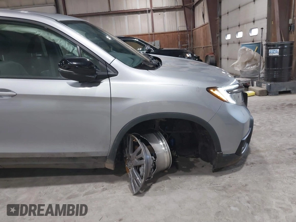 2021 Honda Passport EX-L with VIN 5FNYF8H56MB000107, listed as a IAAI auction lot 41868429 with 66,572 mi miles and . Bid and sale history available at DreamBid. Image 18.