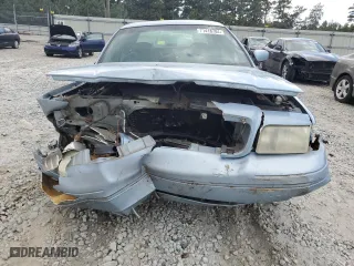1999 Ford Crown Victoria LX with VIN 2FAFP74WXXX137154, listed as a Copart auction lot 71418784 with 97,589 mi miles and Salvage Title. Bid and sale history available at carsss.com. Image 5.