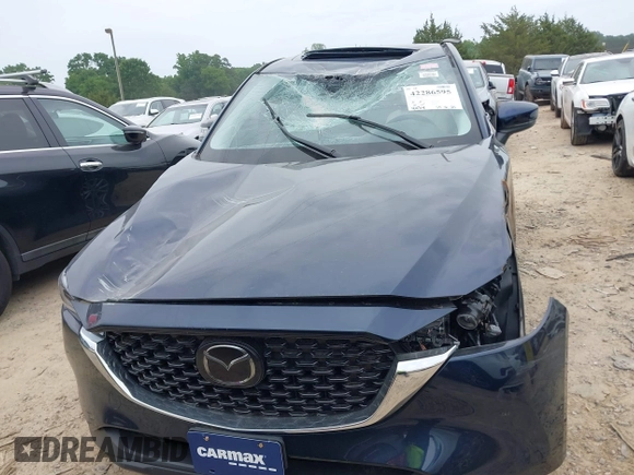 2023 Mazda CX-5 S Carbon Edition z VIN JM3KFBCM6P0251947, wystawiony jako IAAI lot #42286595 z przebiegiem 9 434 mil mil oraz . Historia ofert i sprzedaży dostępna na DreamBid. Obrazek 12.