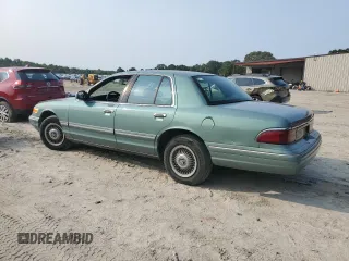 1997 Mercury Grand Marquis GS z VIN 2MELM74W2VX663313, wystawiony jako Copart lot #59539665 z przebiegiem 260 024 mil mil oraz Czysty tytuł • Clean title. Historia ofert i sprzedaży dostępna na DreamBid. Obrazek 2.