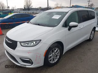 2023 Chrysler Pacifica Touring L with VIN 2C4RC1BG6PR520945, listed as a IAAI auction lot 41591128 with 70,351 mi miles and . Bid and sale history available at DreamBid. Image 2.
