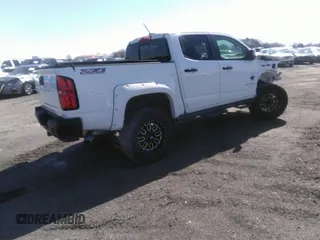 2021 Chevrolet Colorado 4WD Z71 with VIN 1GCGTDEN6M1166282, listed as a IAAI auction lot 40316921 with 35,515 mi miles and . Bid and sale history available at DreamBid. Image 4.