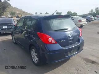 2012 Nissan Versa S with VIN 3N1BC1CPXCK250182, listed as a IAAI auction lot 41697818 with 122,450 mi miles. Bid and sale history available at carsss.com. Image 3.