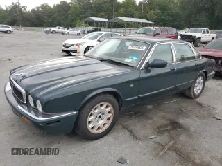 1999 Jaguar XJ with VIN SAJHX1044XC865054, listed as a Copart auction lot 57825325 with 71,145 mi miles and Clean title. Bid and sale history available at DreamBid. Image 1.