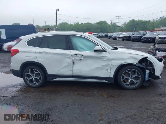 2018 BMW X1 xDrive28i with VIN WBXHT3C38J5L31322, listed as a IAAI auction lot 42260190 with 70,266 mi miles and . Bid and sale history available at DreamBid. Image 13.