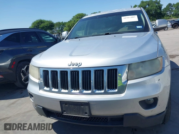 2012 Jeep Grand Cherokee Laredo with VIN 1C4RJEAG5CC112230, listed as a IAAI auction lot 41997483 with 302,923 mi miles. Bid and sale history available at carsss.com. Image 12.