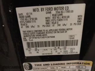 2014 Ford F-150 XL with VIN 1FTFW1ETXEFC67698, listed as a IAAI auction lot 41396295 with 174,096 mi miles. Bid and sale history available at carsss.com. Image 9.