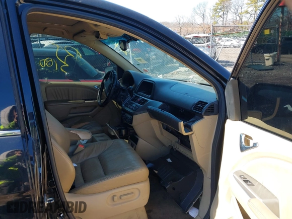 2009 Honda Odyssey EX-L with VIN 5FNRL38759B055396, listed as a IAAI auction lot 41863703 with 999,999 mi miles. Bid and sale history available at carsss.com. Image 5.